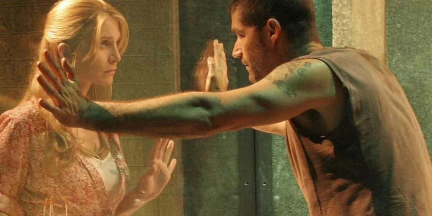 Juliet on one side of the glass and Jack on the other after he is captured in LOST