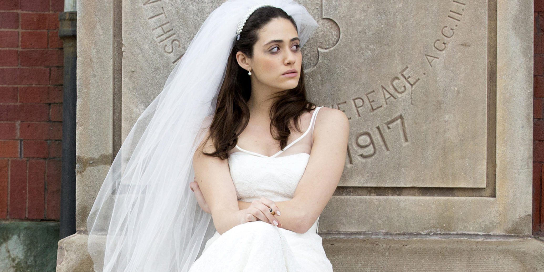 Fiona sits outside in her wedding dress