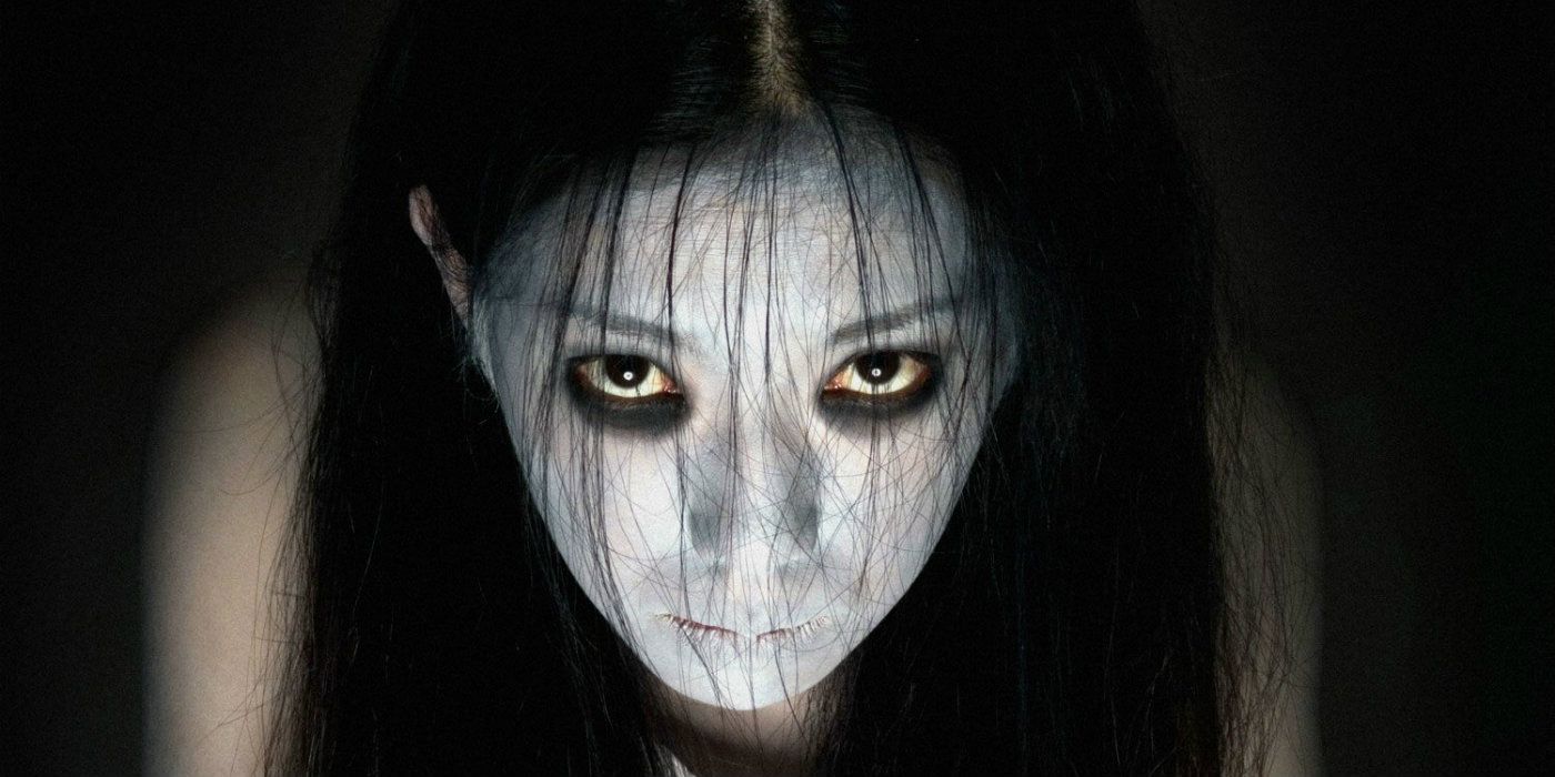 Kayako in The Grudge looking up with a white face.