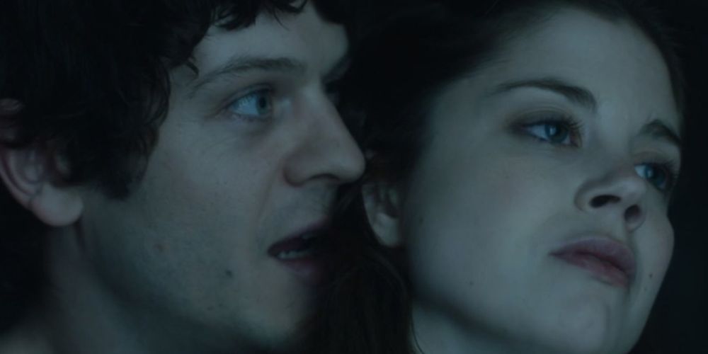 Ramsay whispers in Theon's ear in Game of Thrones