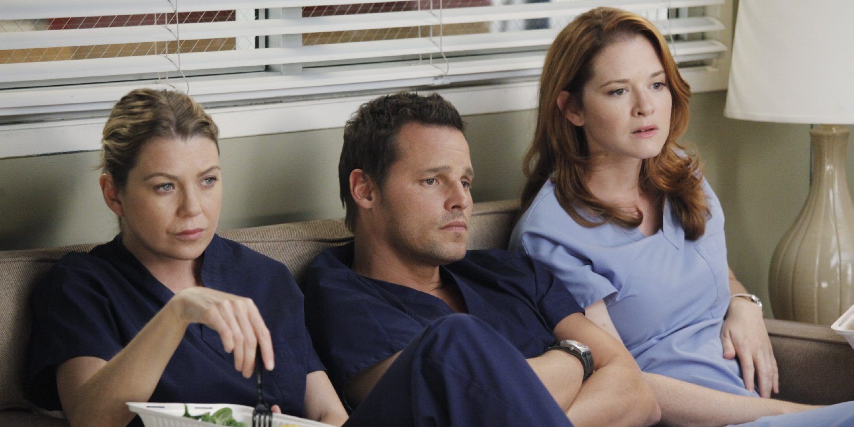 Alex, April, and Meredith sitting on a couch together in Grey's Anatomy