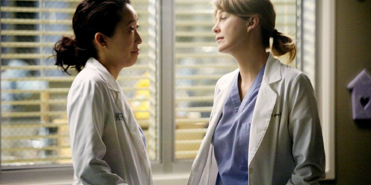 Meredith and Cristina talking to each other at the hospital