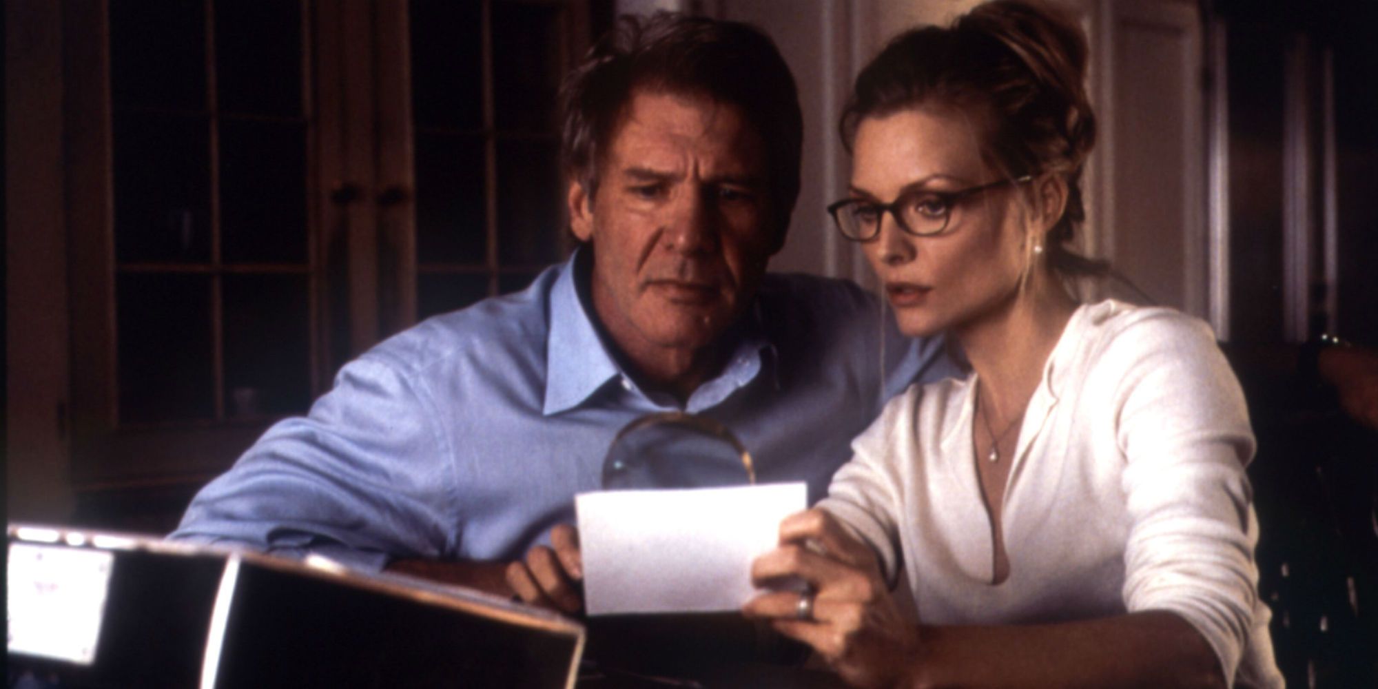 Harrison Ford and Michelle Pfeiffer in What Lies Beneath investigating the missing person photo 