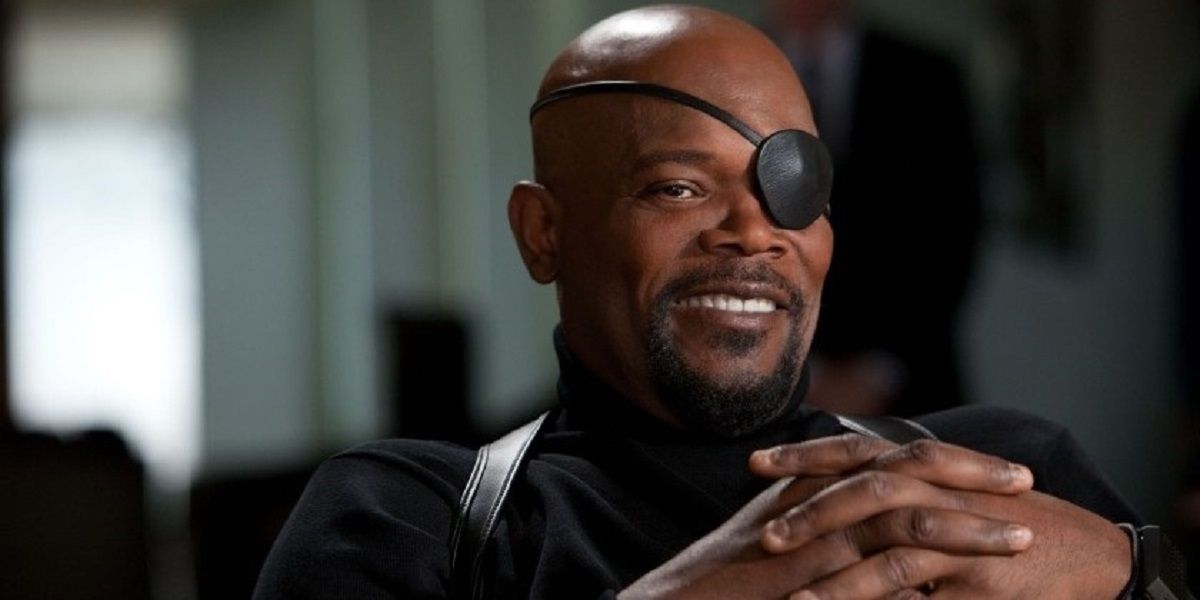Nick Fury sitting down and smiling in Captain America: The Winter Soldier