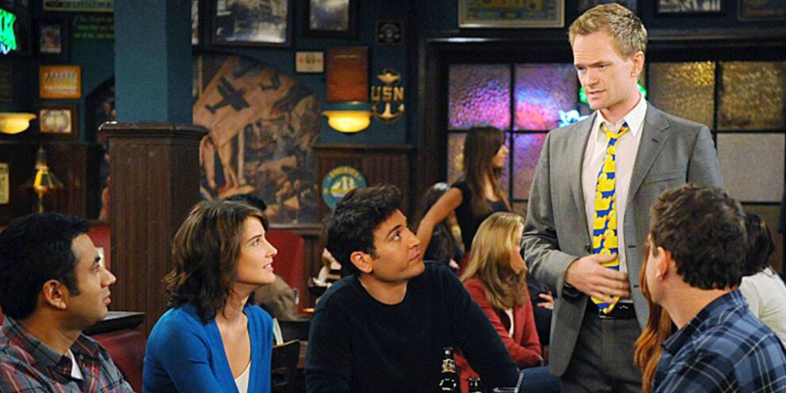 Barney wears the ducky tie in front of the group in How I Met Your Mother