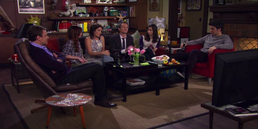 The HIMYM sitting together at Ted and Tracy's apartment in How I Met Your Mother