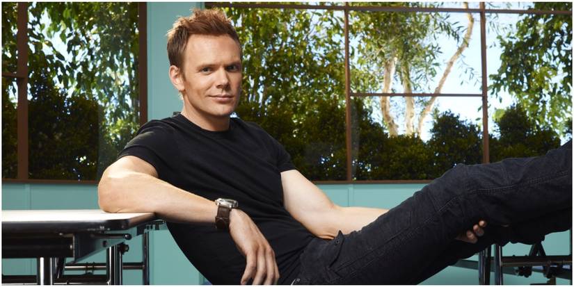 Jeff Winger puts his feet on a table in Community