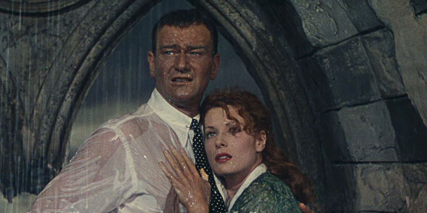 Mary Kate clinging to Sean under a rainfall in The Quiet Man.