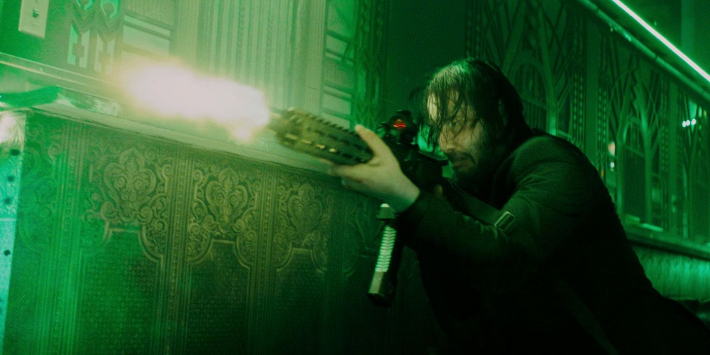 John Wick firing a machine gun