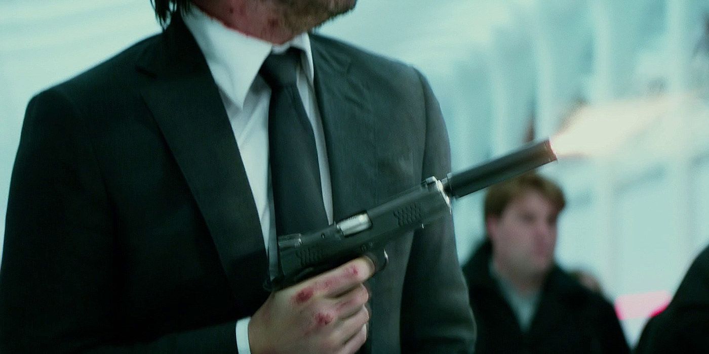 John Wick firing a suppressed pistol in John Wick 2