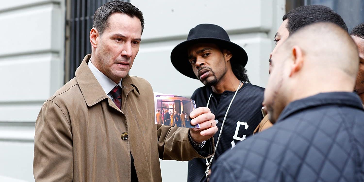 Detective Scott Galban (Keanu Reeves) showing a photo to someone in exposed.