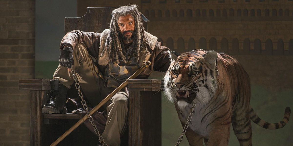 King Ezekiel sits next to tiger Shiva in The Walking Dead