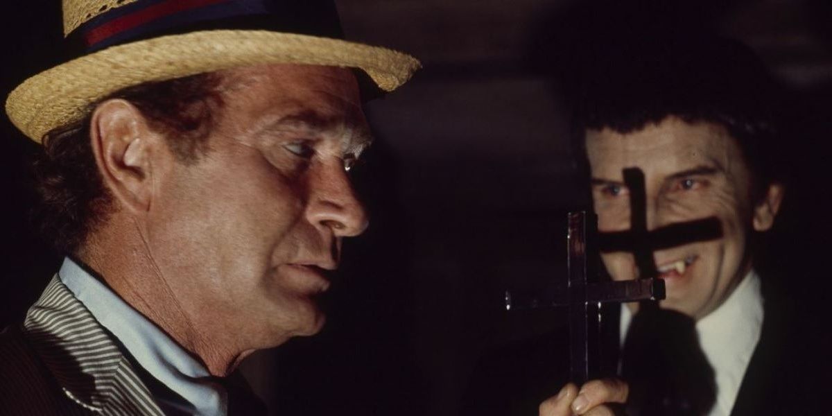 Kolchak fends off a vampire with a cross from Kolchak: The Night Stalker