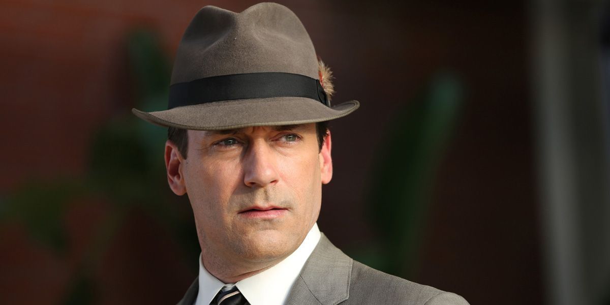 Don Draper wearing a fedora and looking serious on Mad Men
