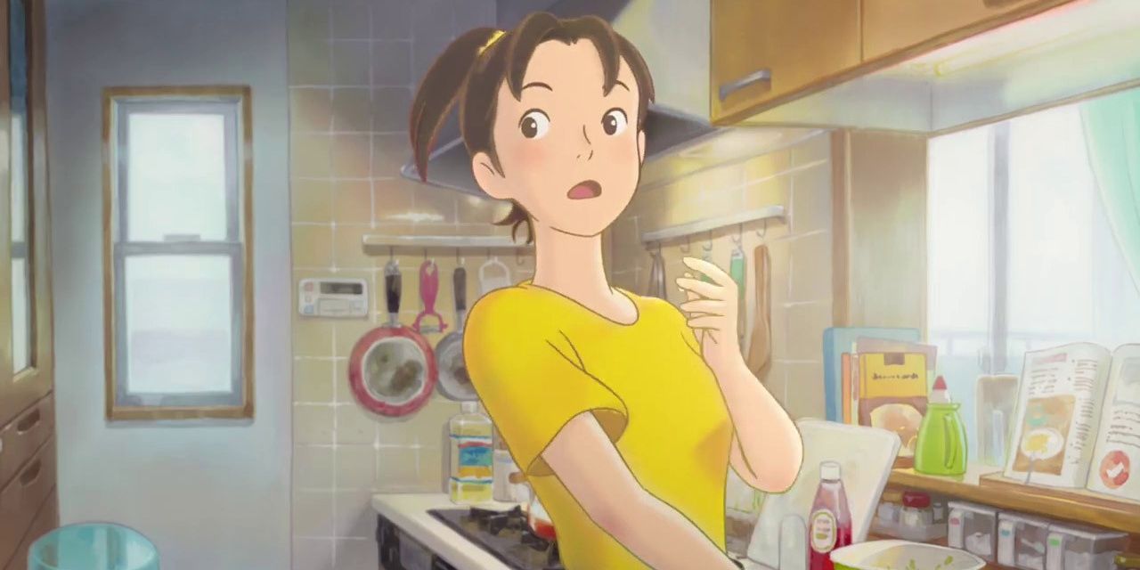 A women standing in a kitchen in a still from Modest Heroes