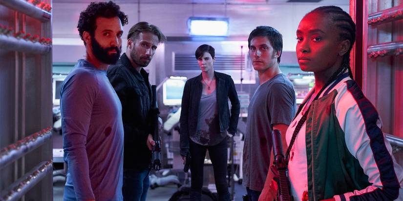 Marwan Kenzari, Matthias Schoenaerts, Charlize Theron, Luca Marinelli, and KiKi Layne look toward the camera in The Old Guard