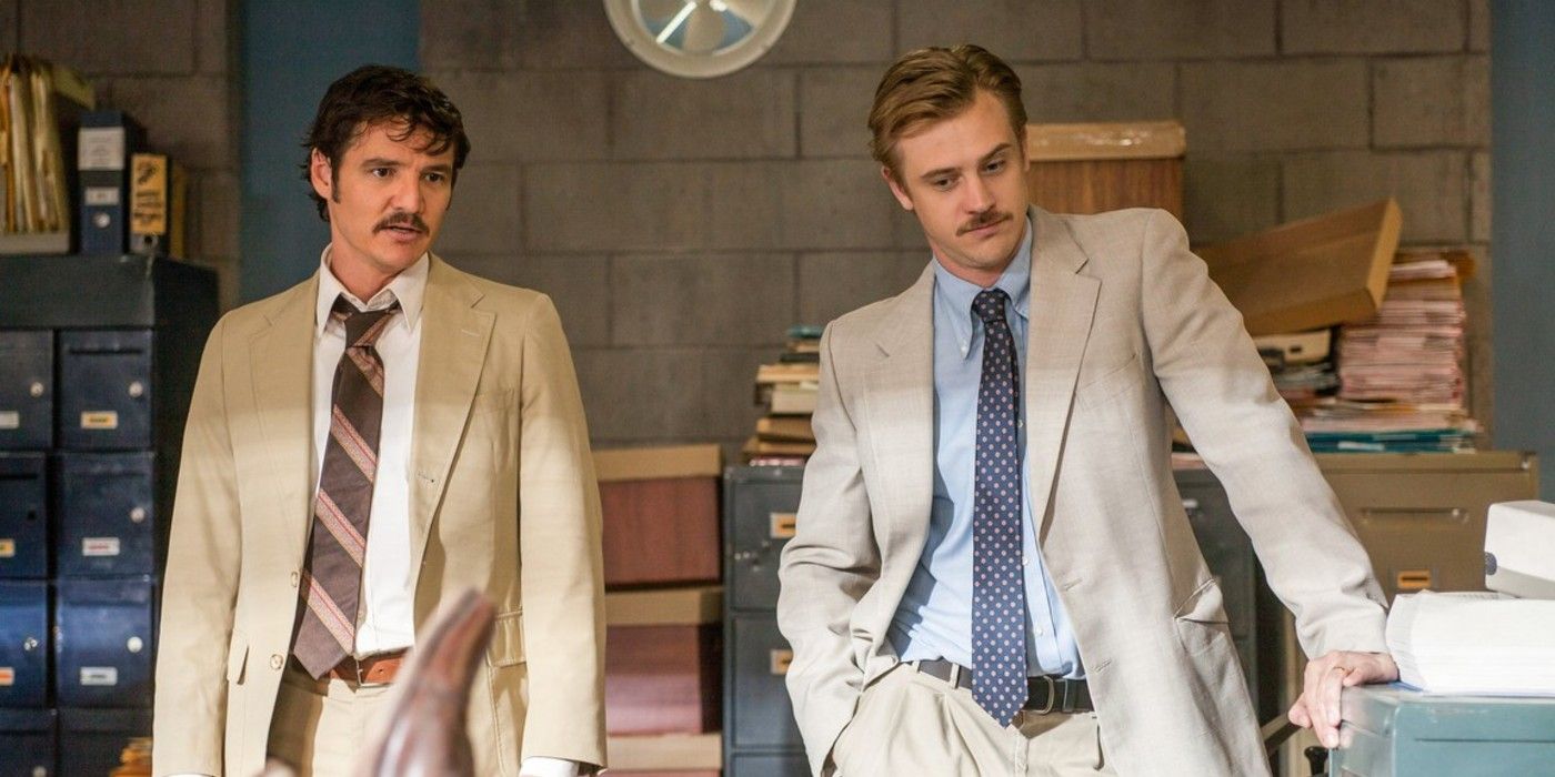 Pedro Pascal and Boyd Holbrook stand in an office in Narcos