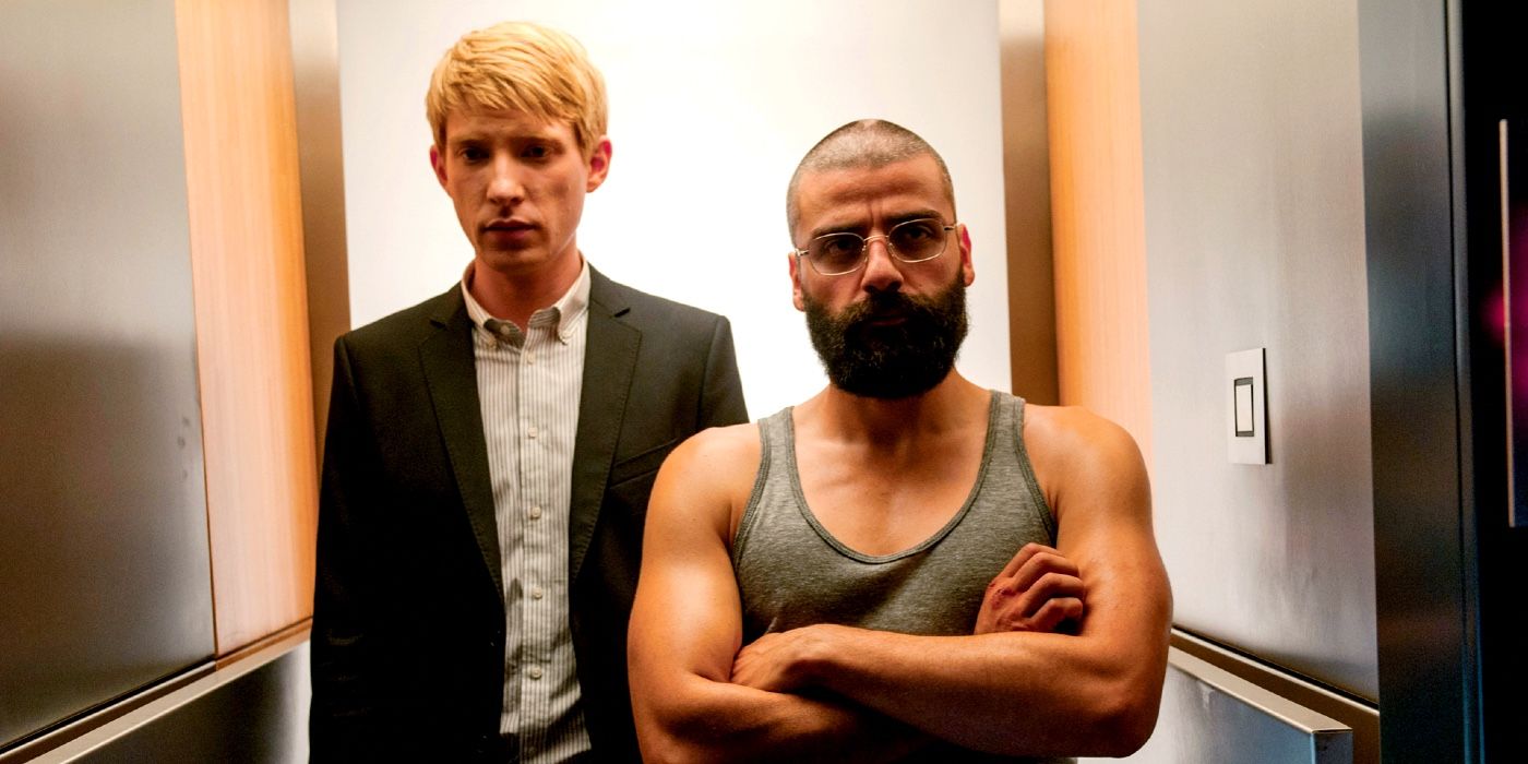 Oscar Isaac and Domnhall Gleeson standing in an elevator in Ex Machina