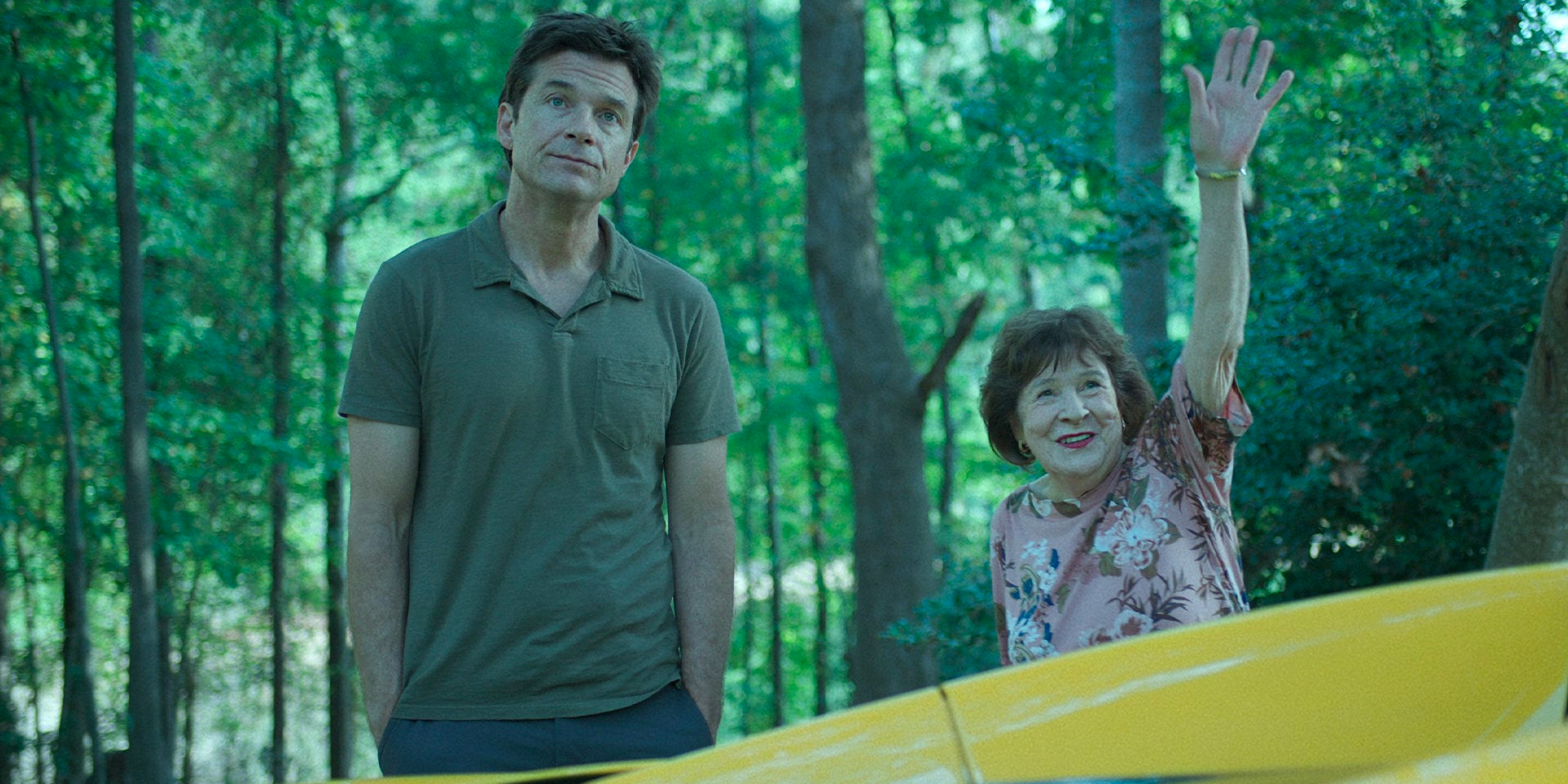 Marty and a woman by a car in Ozark