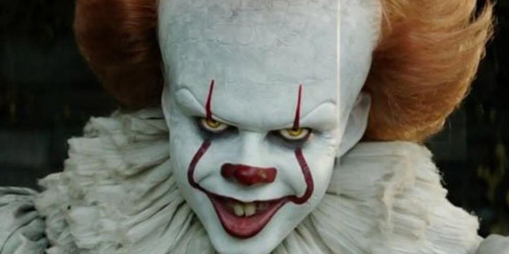 Pennywise from It grinning at the camera