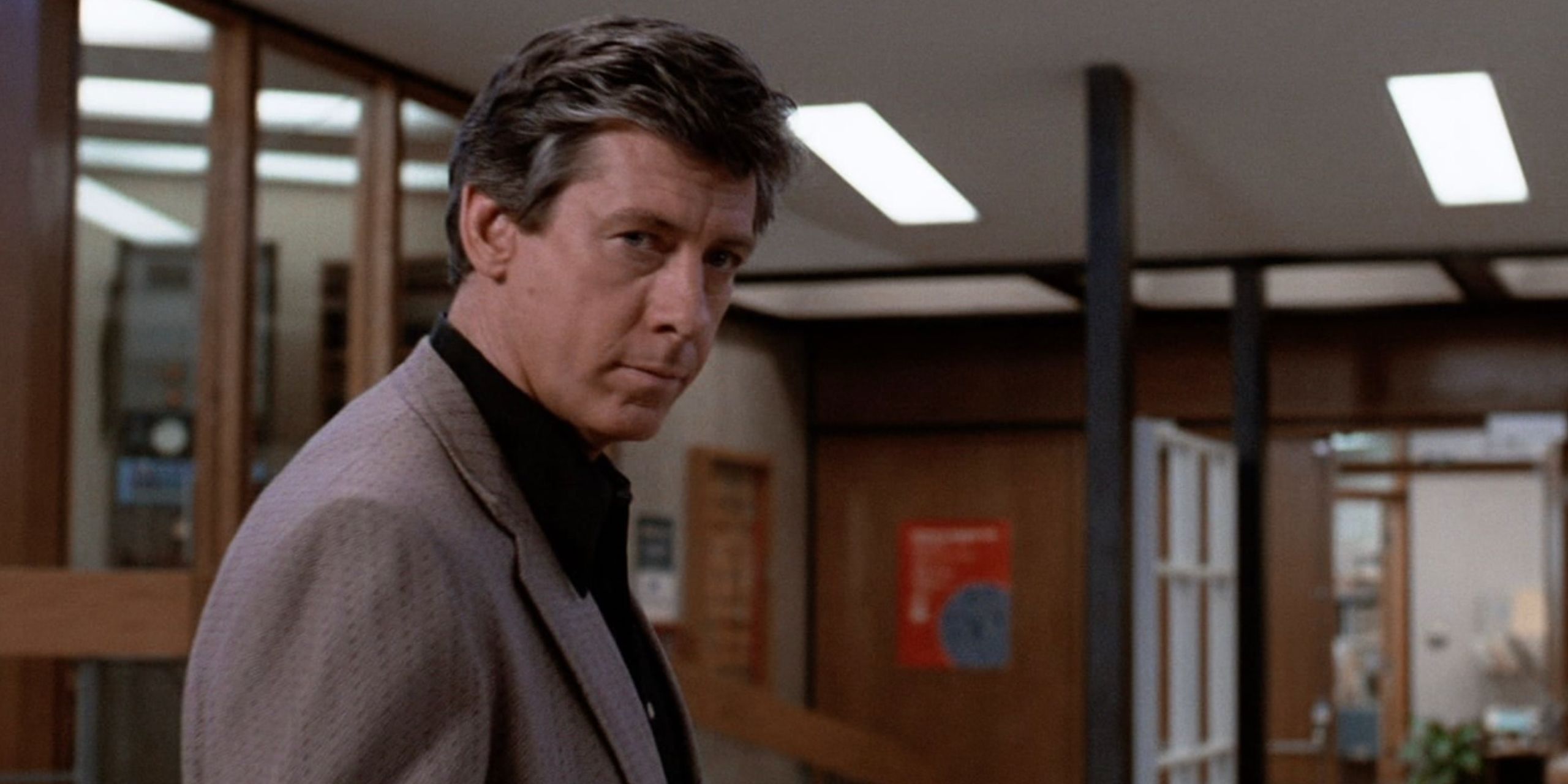 Principal Vernon looks back before leaving the library in The Breakfast Club