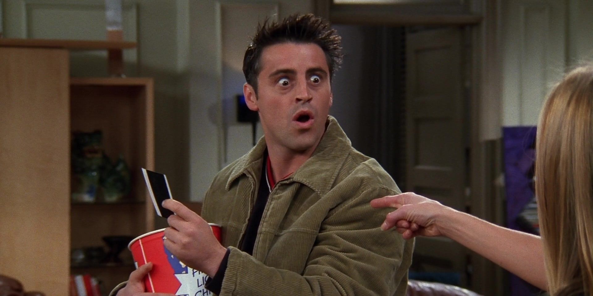 Rachel catches Joey eating chicken and looking at a naked picture of Monica in Friends