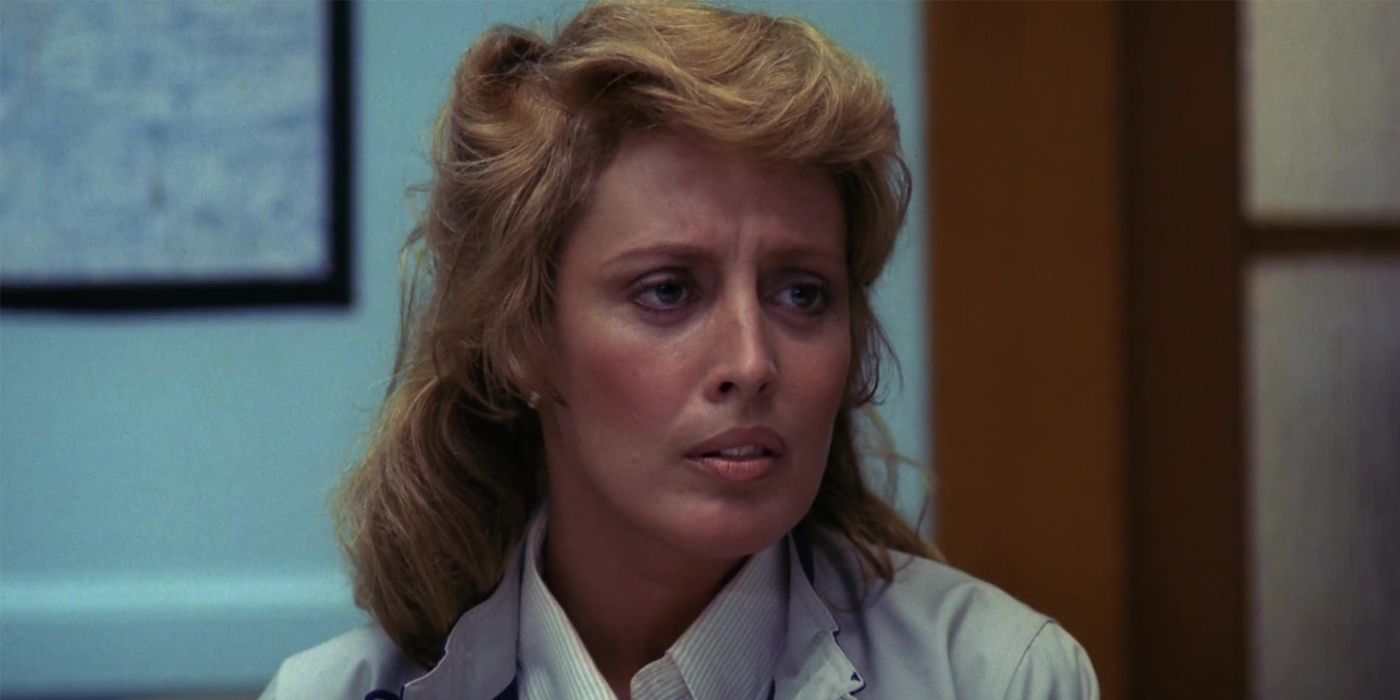 Marge Thompson looks off into the distance upset in A Nightmare on Elm Street.