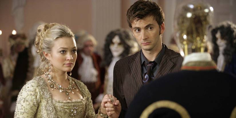 The Tenth Doctor and Madame de Pompadour holding hands while talking to a clockwork droid in the Doctor Who episode "The Girl in the Fireplace."