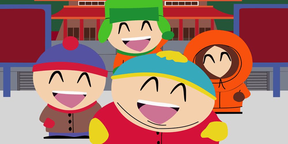 Kyle, Cartman, Kenny, and Stan smiling in front of a building in South Park.
