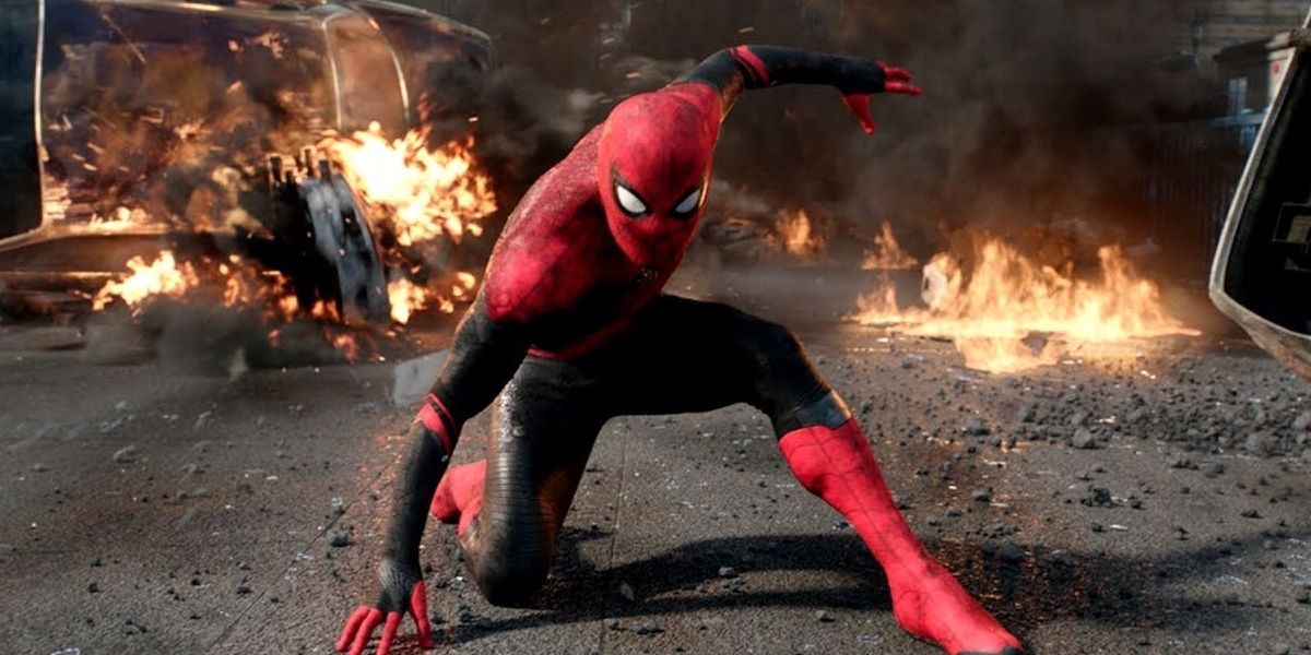 Spider-Man lands in a superhero pose in front of rubble