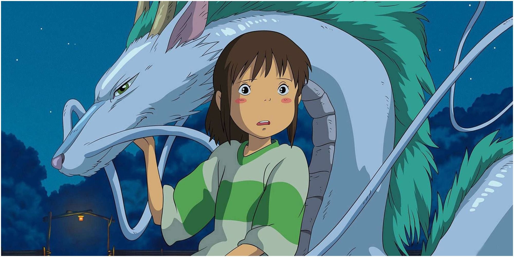 Chihiro holds onto a dragon in Spirited Away.