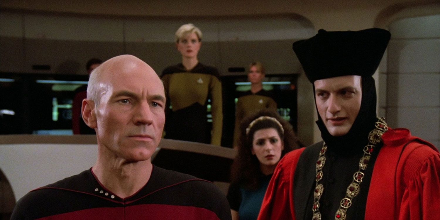 Q in Judge’s Gear on the bridge of the Enterprise as Picard thinks.