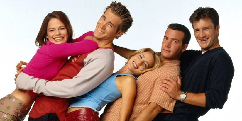 The cast of the sitcom Two Guys and a Girl, all leaning back on one another on a white background.