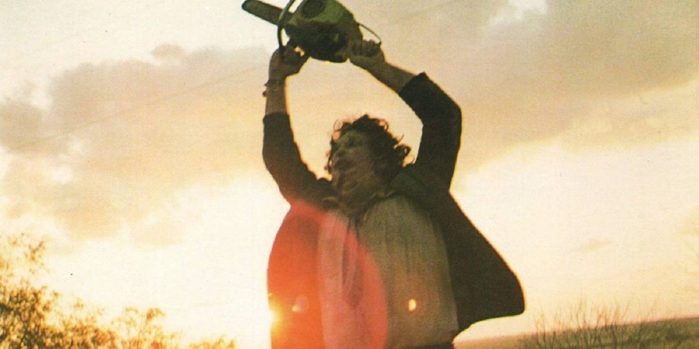 Leatherface twirls with his chainsaw in the sunlight from Texas Chainsaw Massacre
