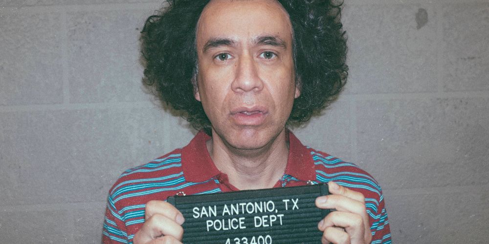 Fred Armisen looks goofy in a mug shot from Documentary Now!