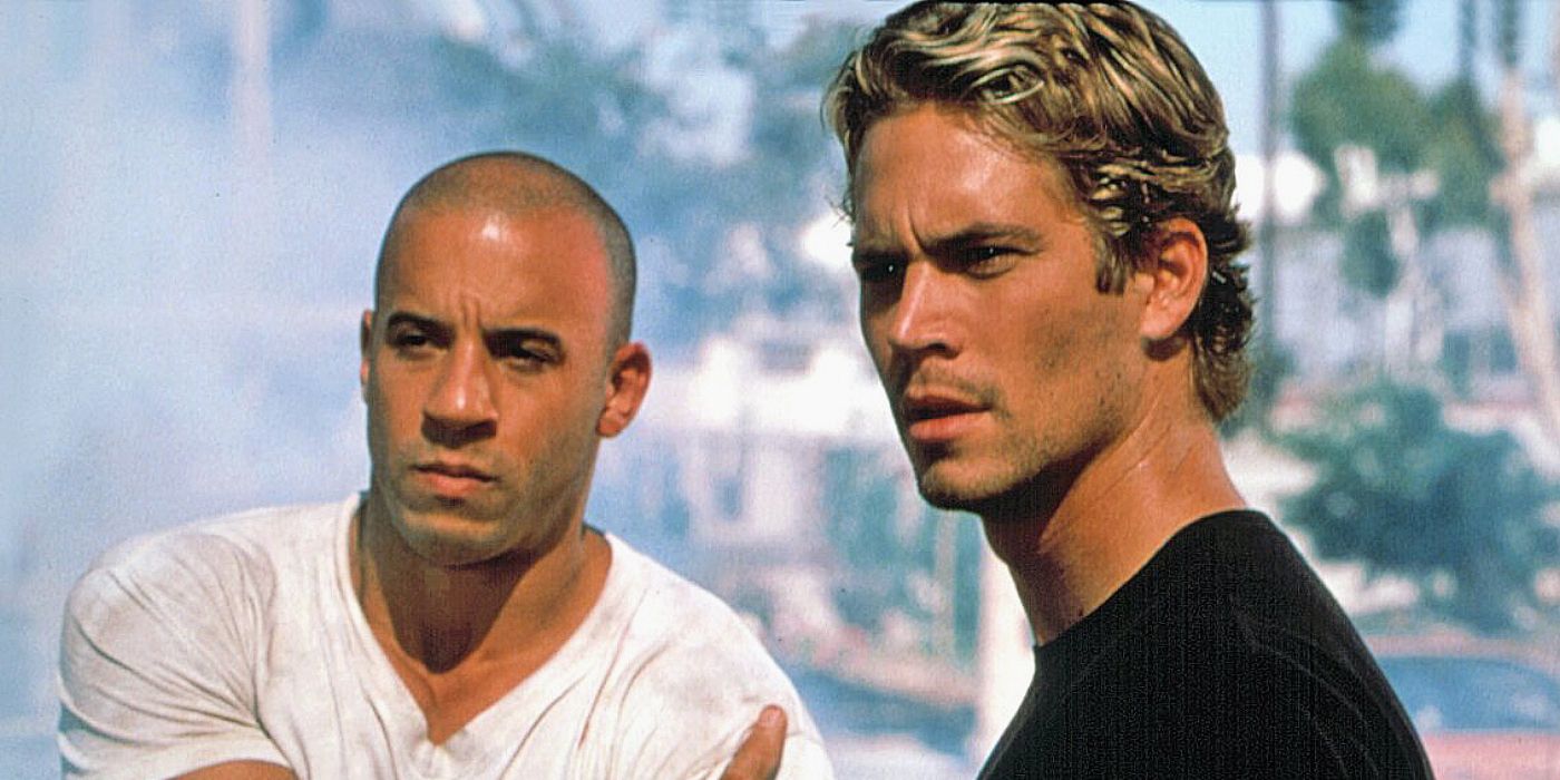 Dom and Brian look concerned after surviving a car crash in The Fast and the Furious