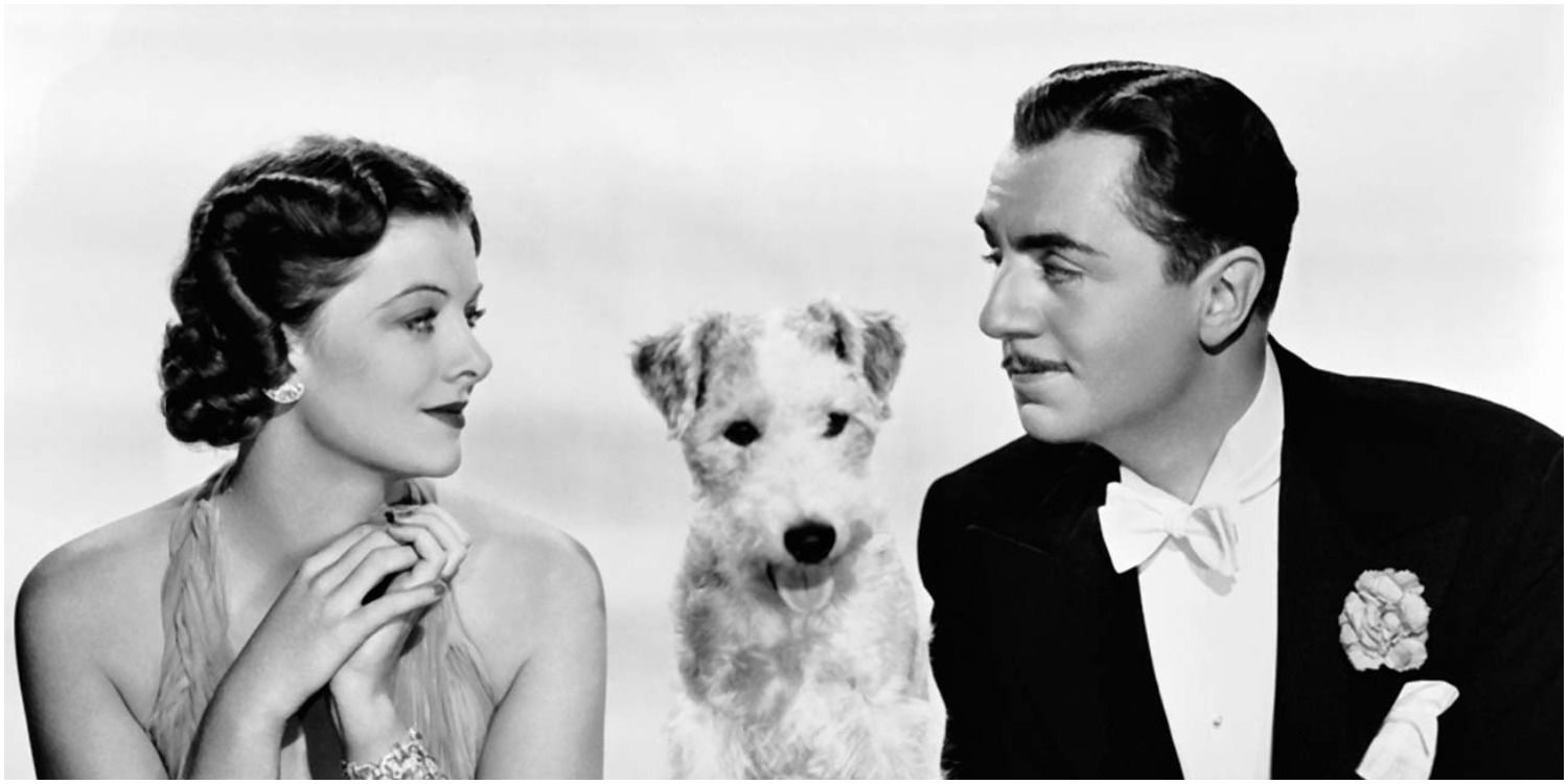 The leads of the Thin Man sitting with a dog
