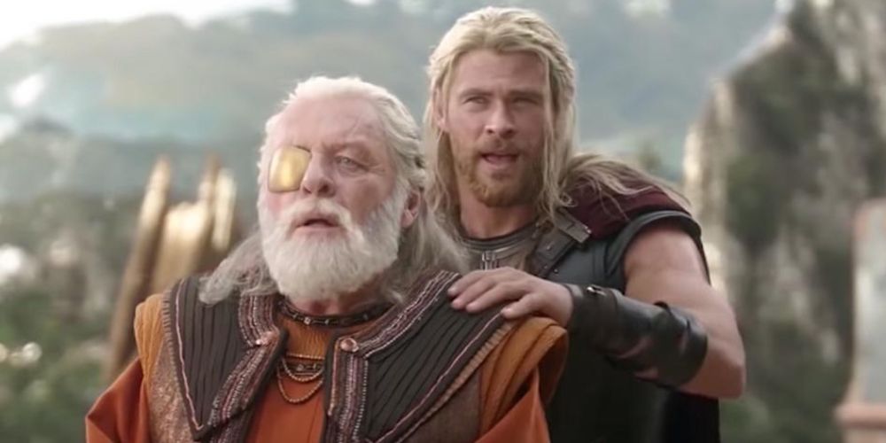 Thor touches the shoulder of Loki as Odin in Thor Ragnarok