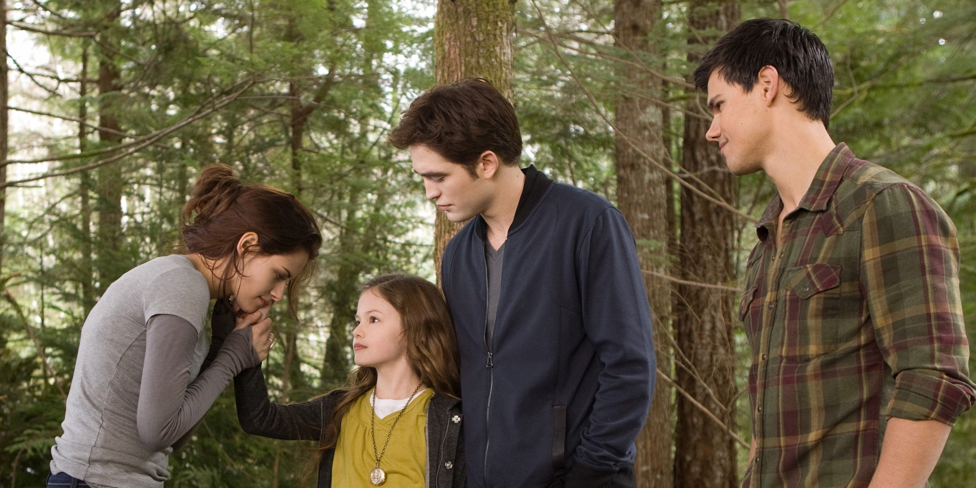 Bella holds Renesmee's hand, while Edward and Jacob look in Breaking Dawn.