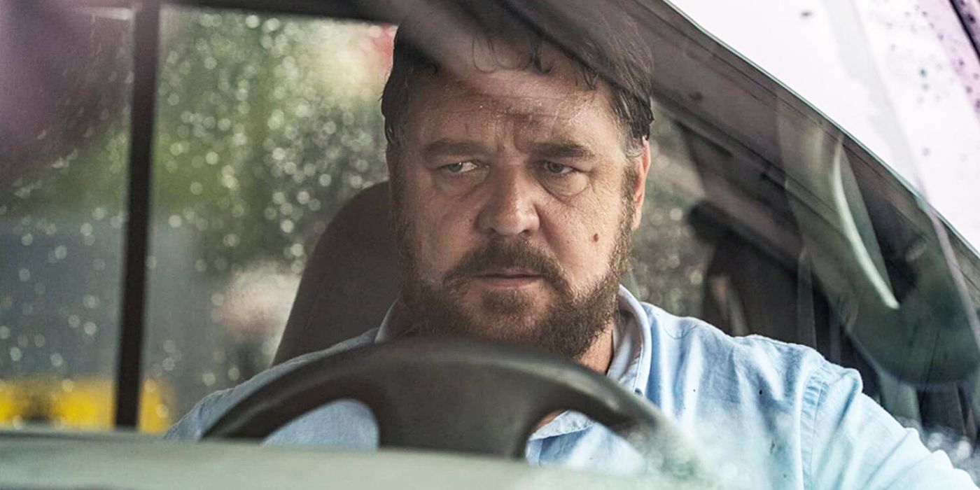 Russell Crowe looks on from behind the wheel of a truck in Unhinged 