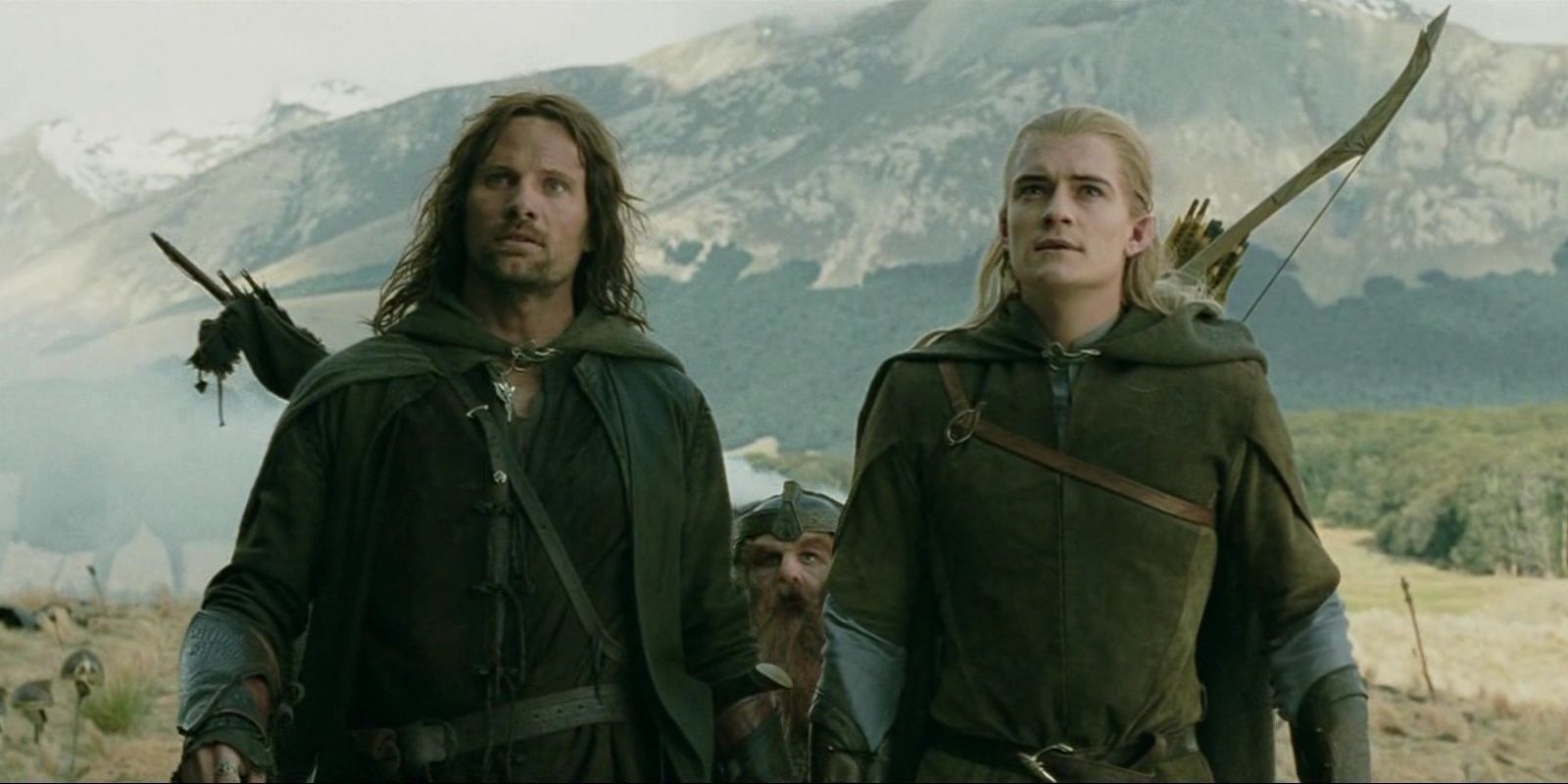 Aragorn anf Legolas standing next to each other in a field
