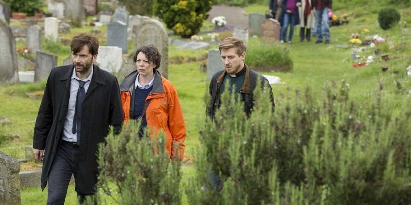 Alec, Ellie, and the Reverend at the graveyard in Broadchurch