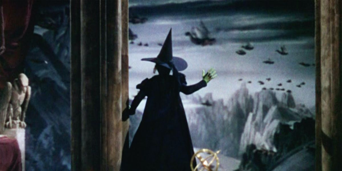 The Wicked Witch watches winged monkeys fly away in The Wizard of Oz
