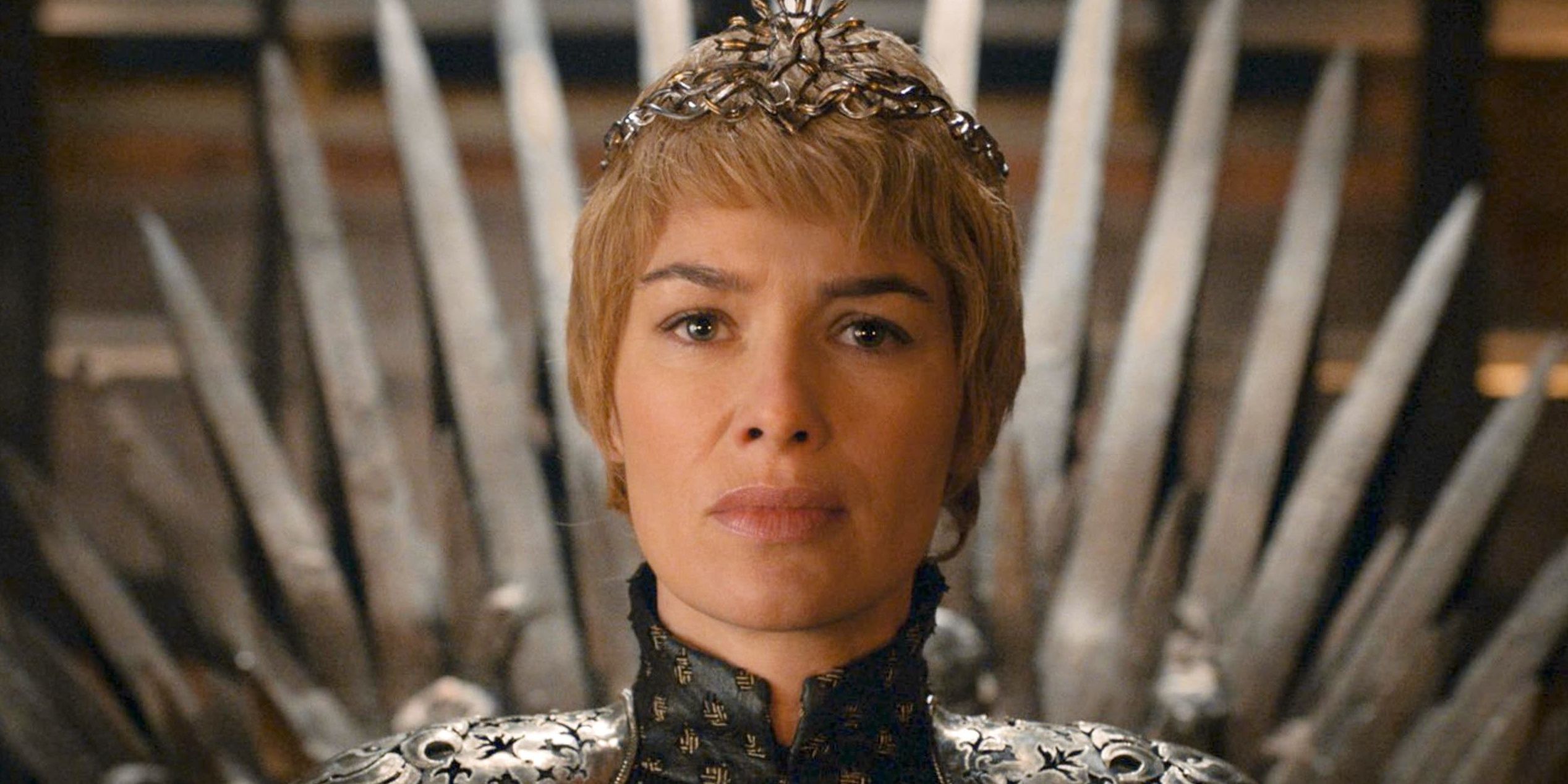 Cersei Lannister (Lena Heady) sitting on the Iron Throne with crown in Game of Thrones