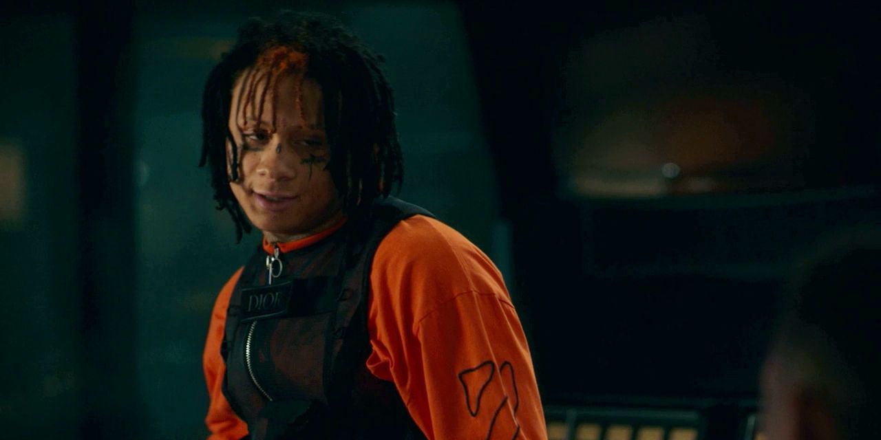 Trippie looking at someone in Dave.