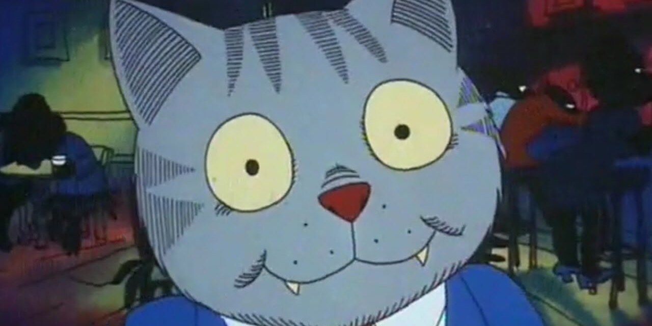 Fritz the Cat smiles awkwardly at the camera