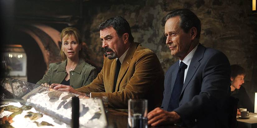 Jesse Stone sitting at a bar between Rose and Captain Healy in Jesse Stone: Innocents Lost