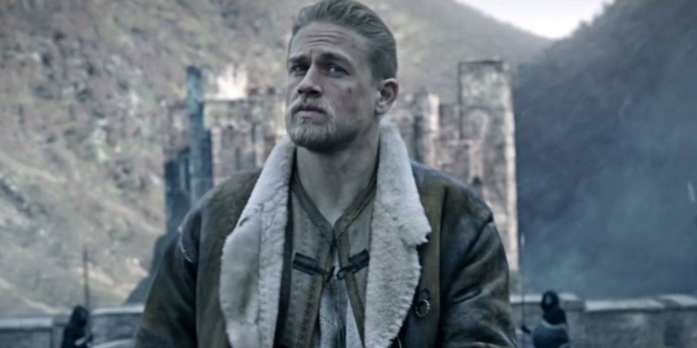 King Arthur stands by a castle in Legend of the Sword