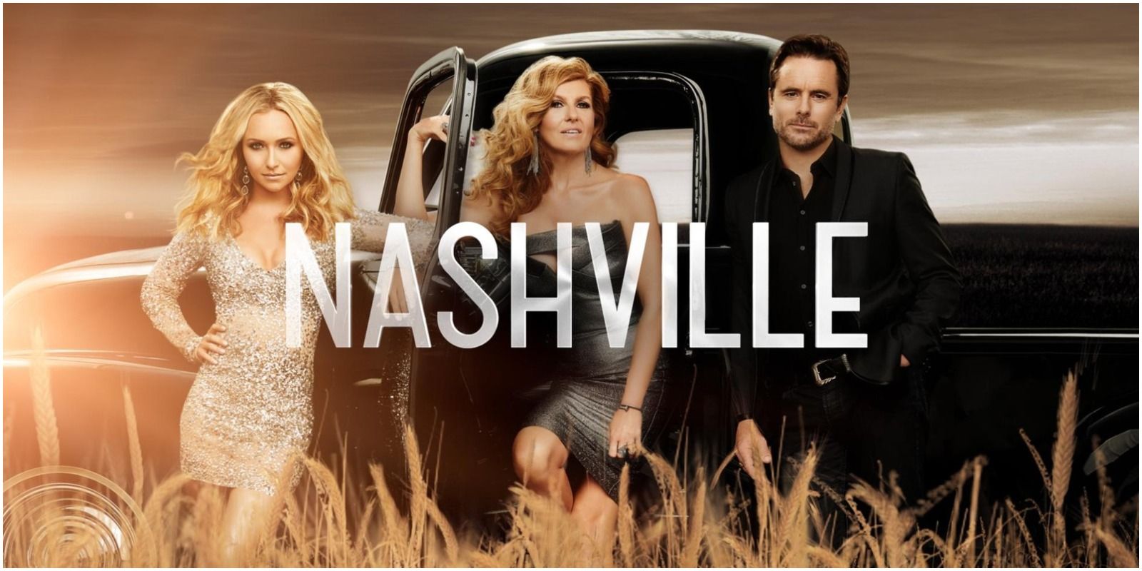 Nashville cast members posing next to a car