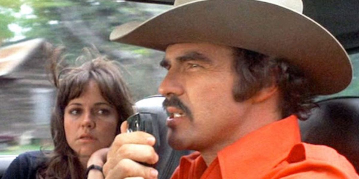 Bandit talks on the CB while Sally Field looks on From Smokey and the Bandit